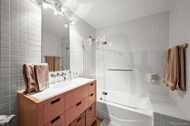 a bathroom with a tub sink and toilet