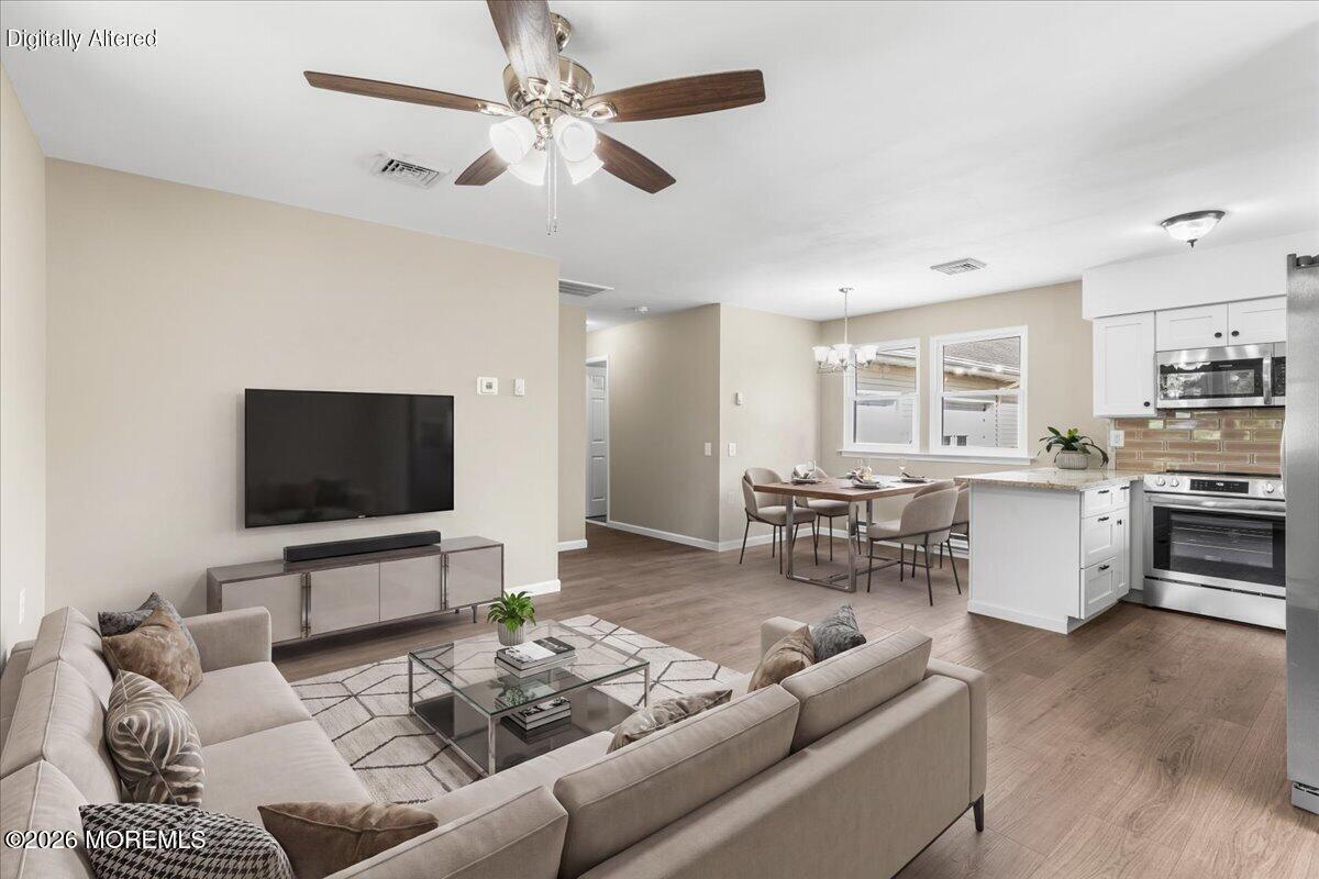 16 D Spring Street, Unit 50 Whiting, NJ 08759 - Photo 11 of 28 a living room with furniture and a flat screen tv