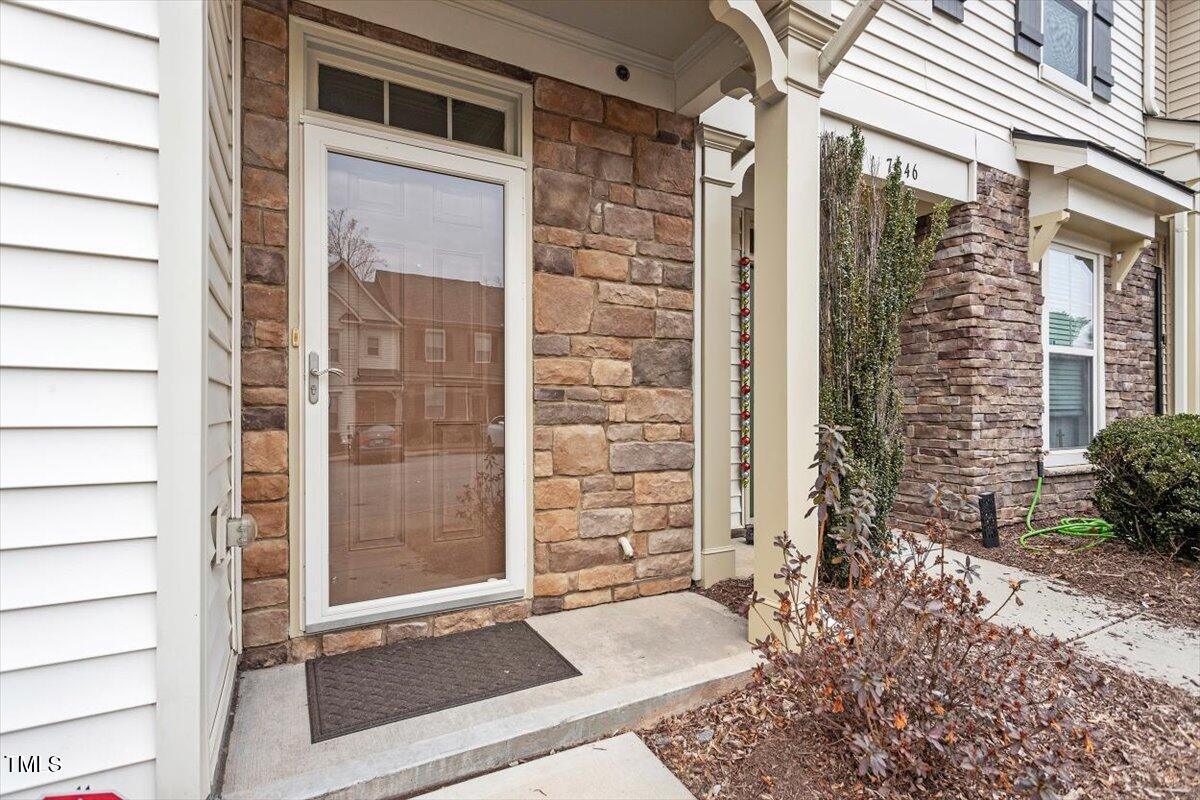 7848 Allscott Way Raleigh, NC 27612 - Photo 4 of 5 a view of front door of house