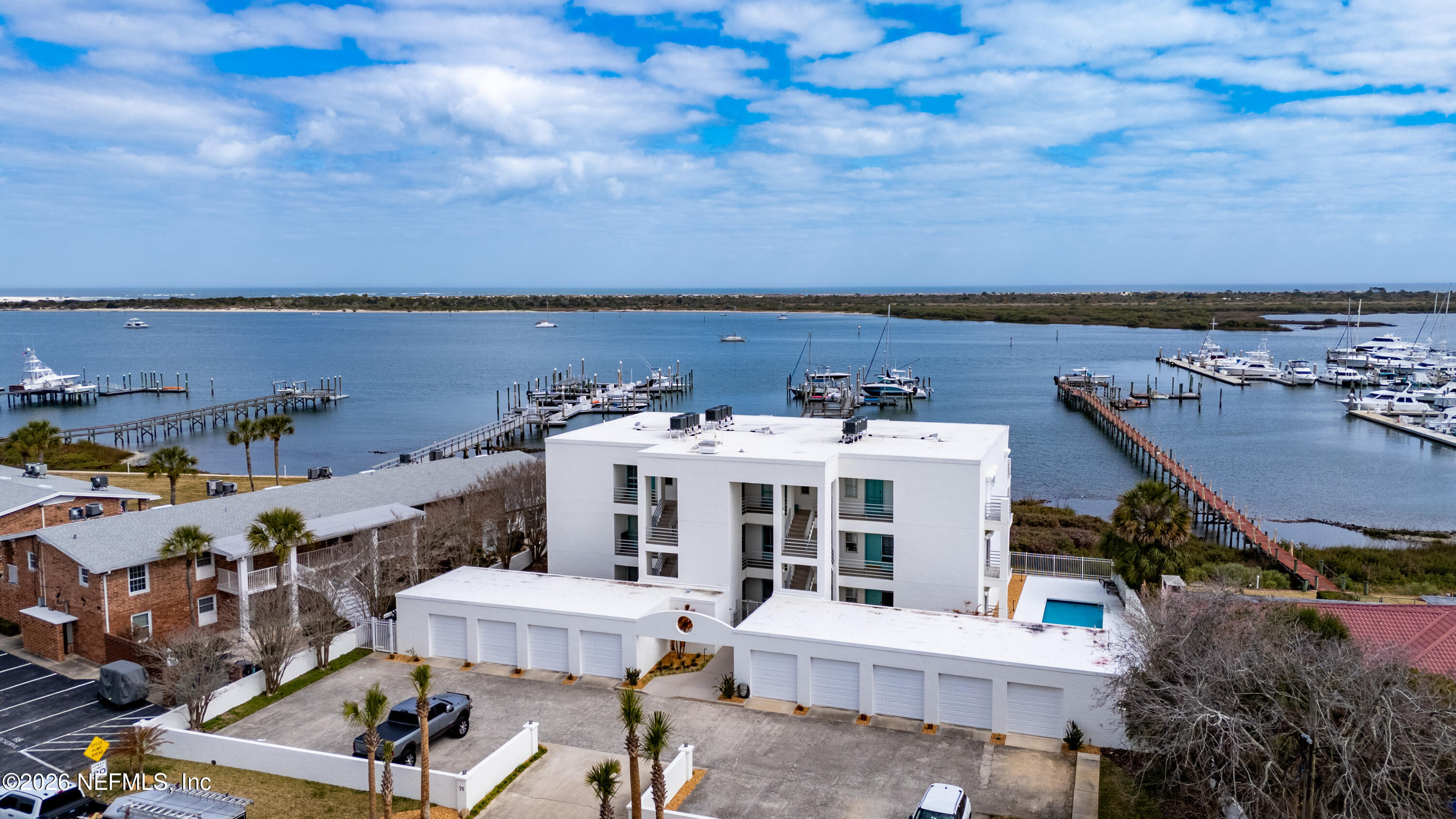 75 Comares Avenue, Unit 3A St. Augustine, FL 32080 - Photo 1 of 41 an aerial view of a house with roof deck and city view