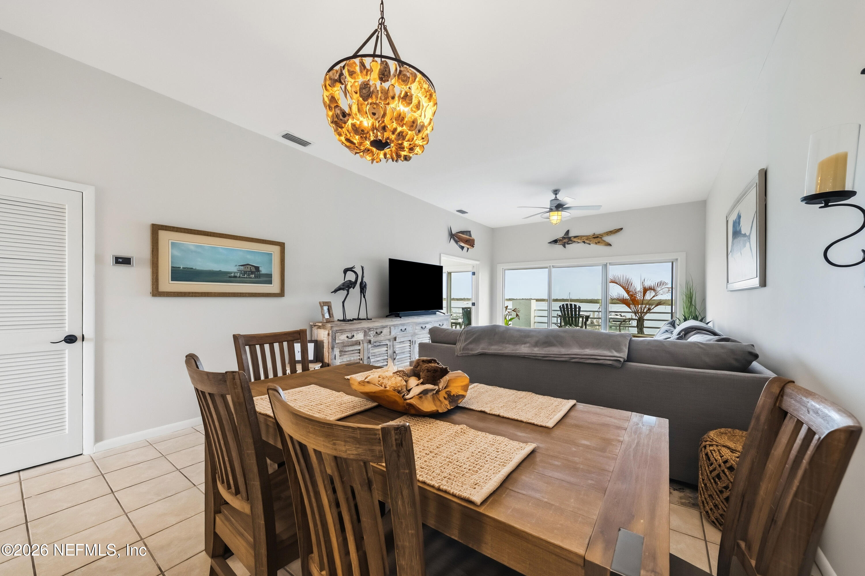 75 Comares Avenue, Unit 3A St. Augustine, FL 32080 - Photo 14 of 41 a view of a dining room with furniture