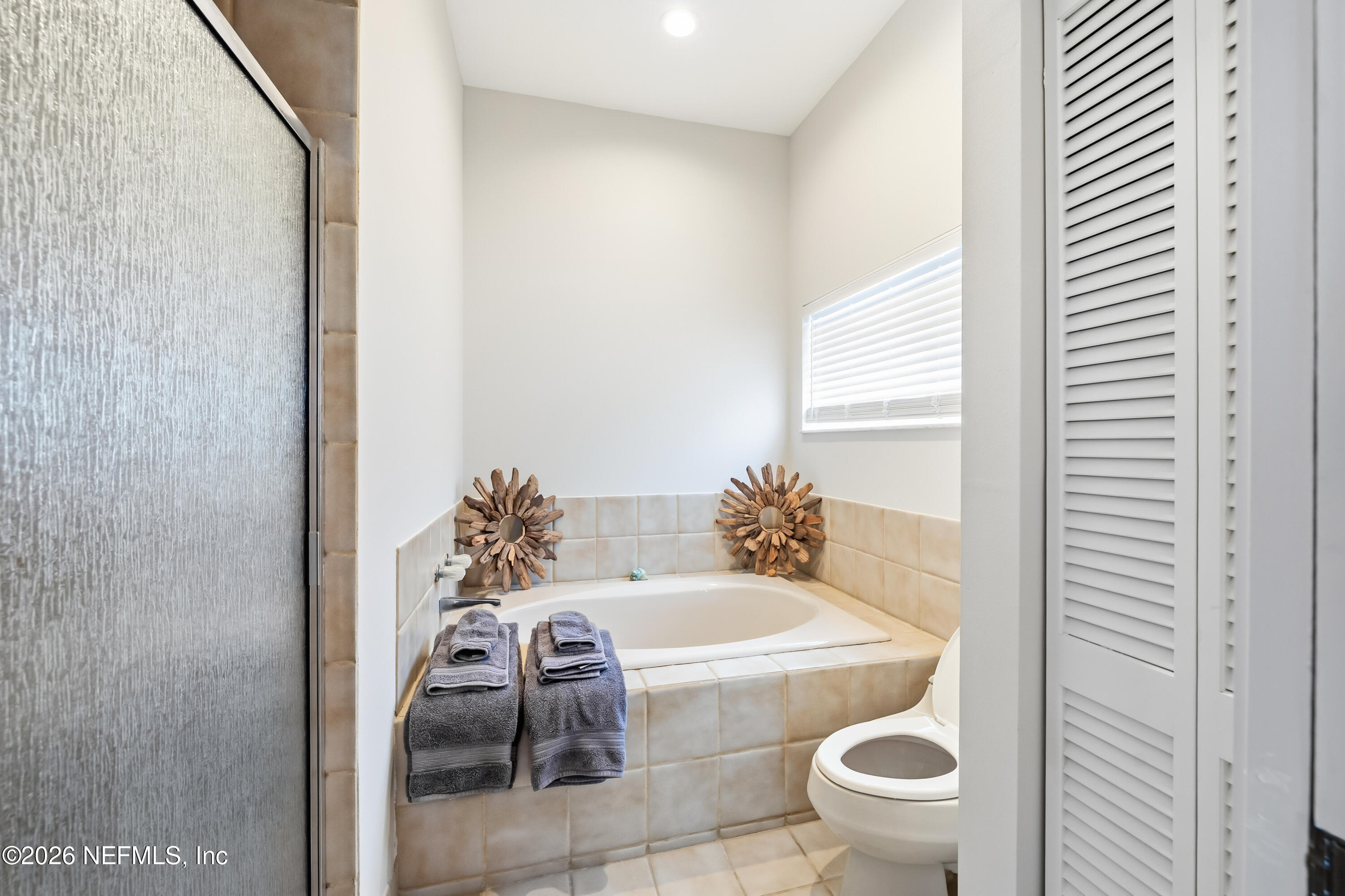 75 Comares Avenue, Unit 3A St. Augustine, FL 32080 - Photo 22 of 41 a bath room with a toilet and a shower