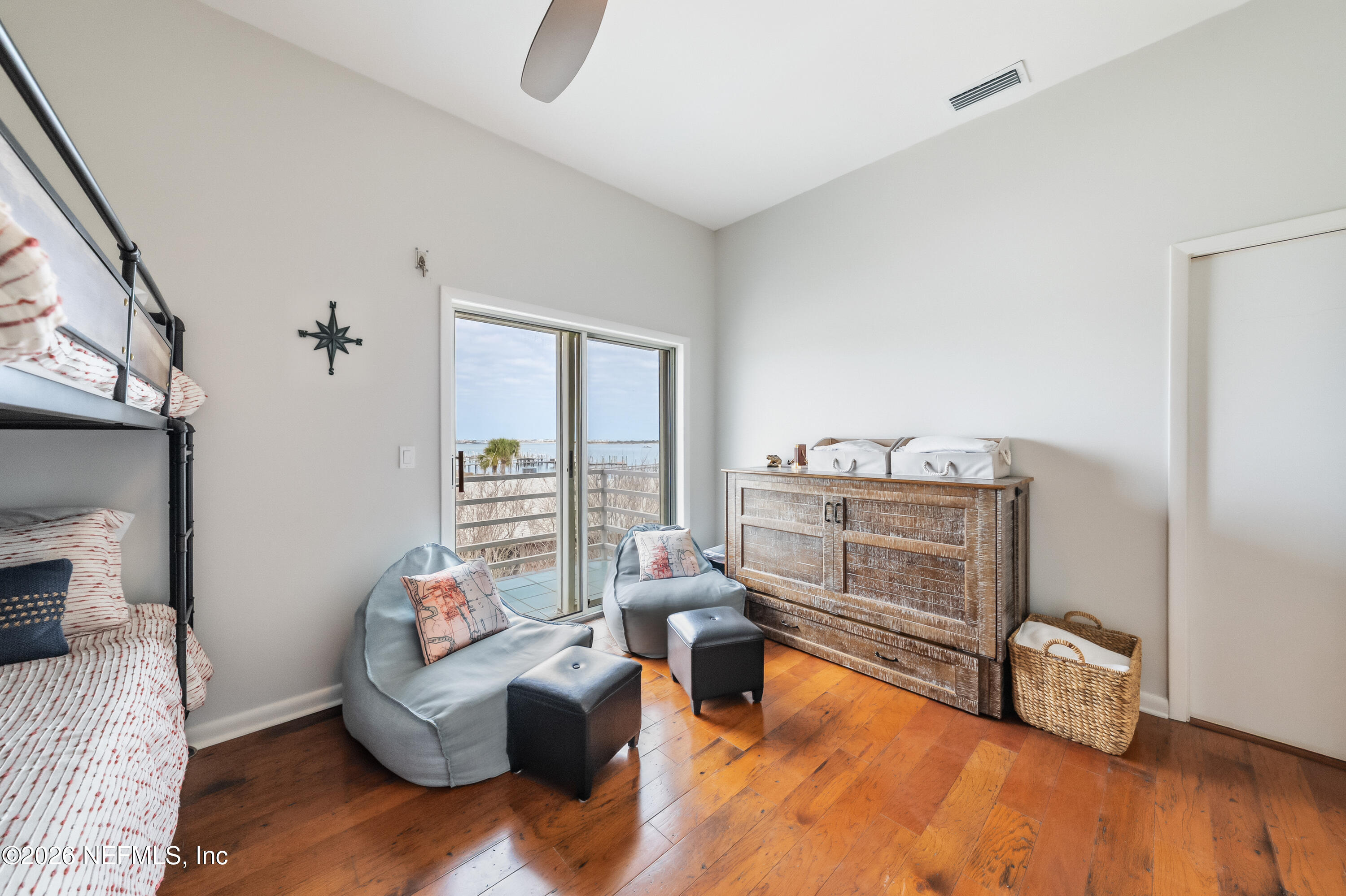 75 Comares Avenue, Unit 3A St. Augustine, FL 32080 - Photo 25 of 41 a living room with furniture and a wooden floor