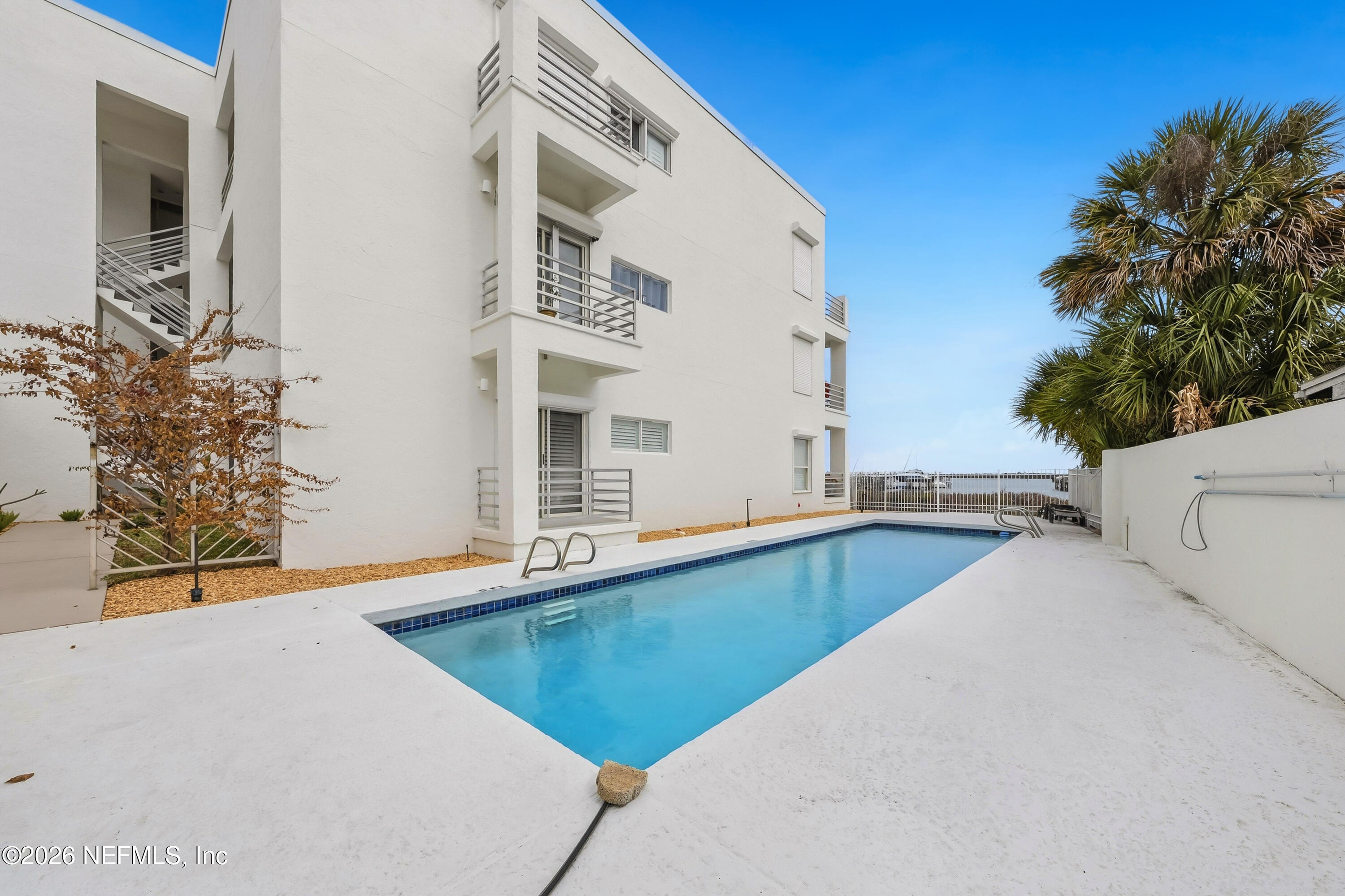 75 Comares Avenue, Unit 3A St. Augustine, FL 32080 - Photo 3 of 41 a view of a swimming pool with an outdoor space