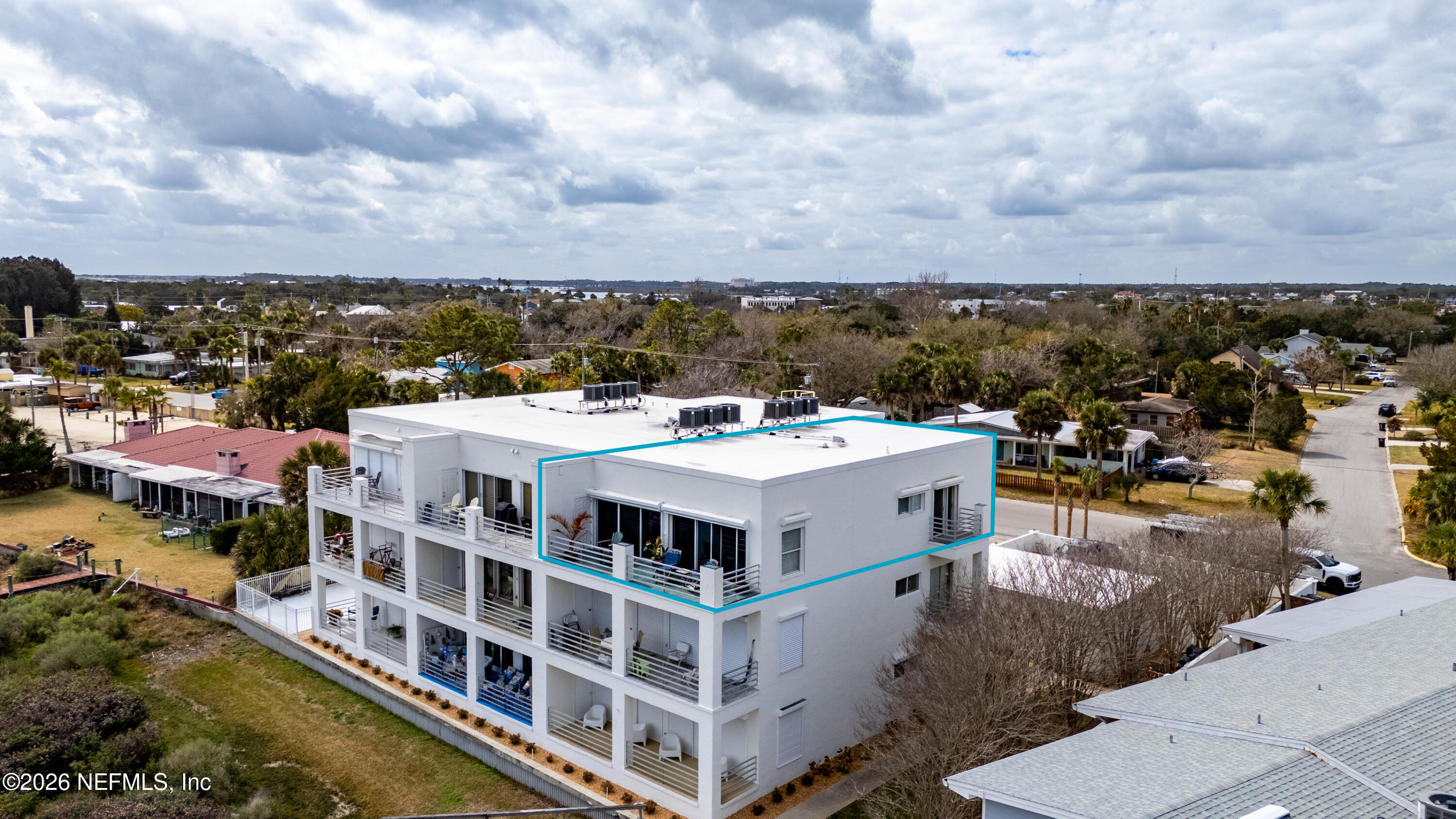 75 Comares Avenue, Unit 3A St. Augustine, FL 32080 - Photo 5 of 41 a view of a white building with a white buildings