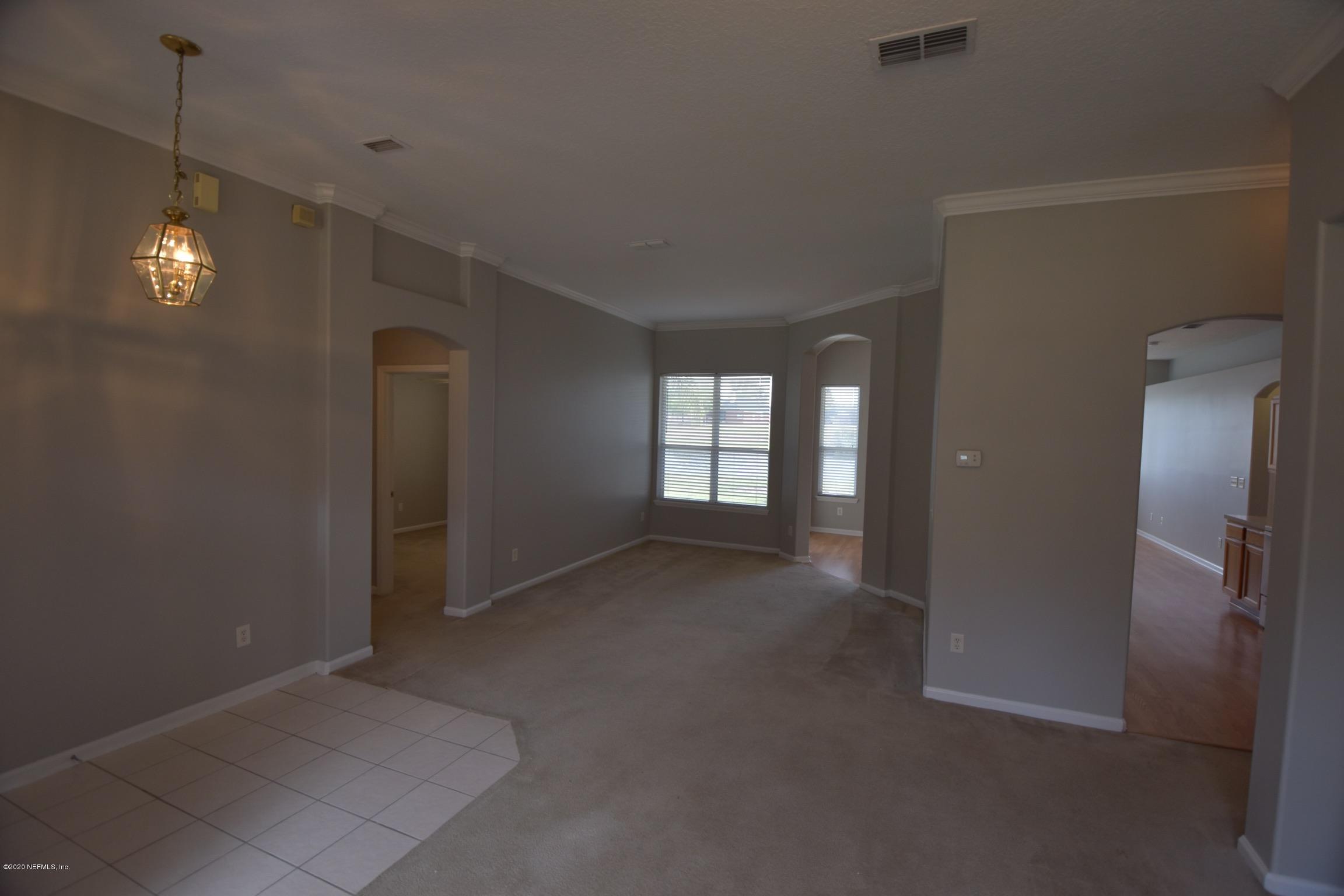 2473 Shelby Creek Road West Jacksonville, FL 32221 - Photo 4 of 9 a view of empty room with windows