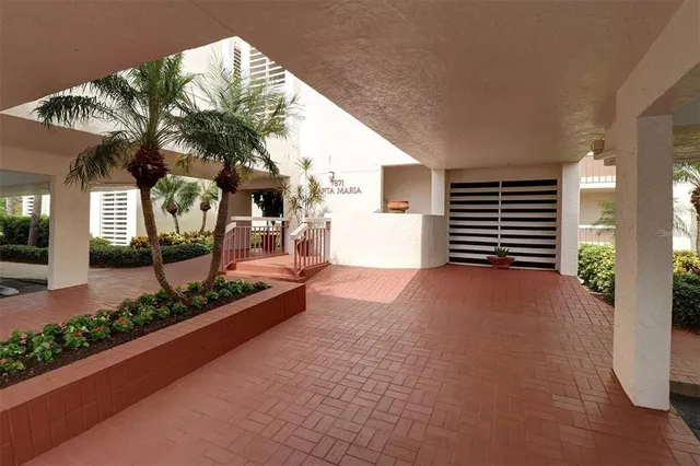 a living room with furniture a chandelier and a window