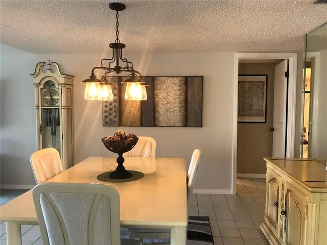 a kitchen with granite countertop a sink stainless steel appliances and cabinets