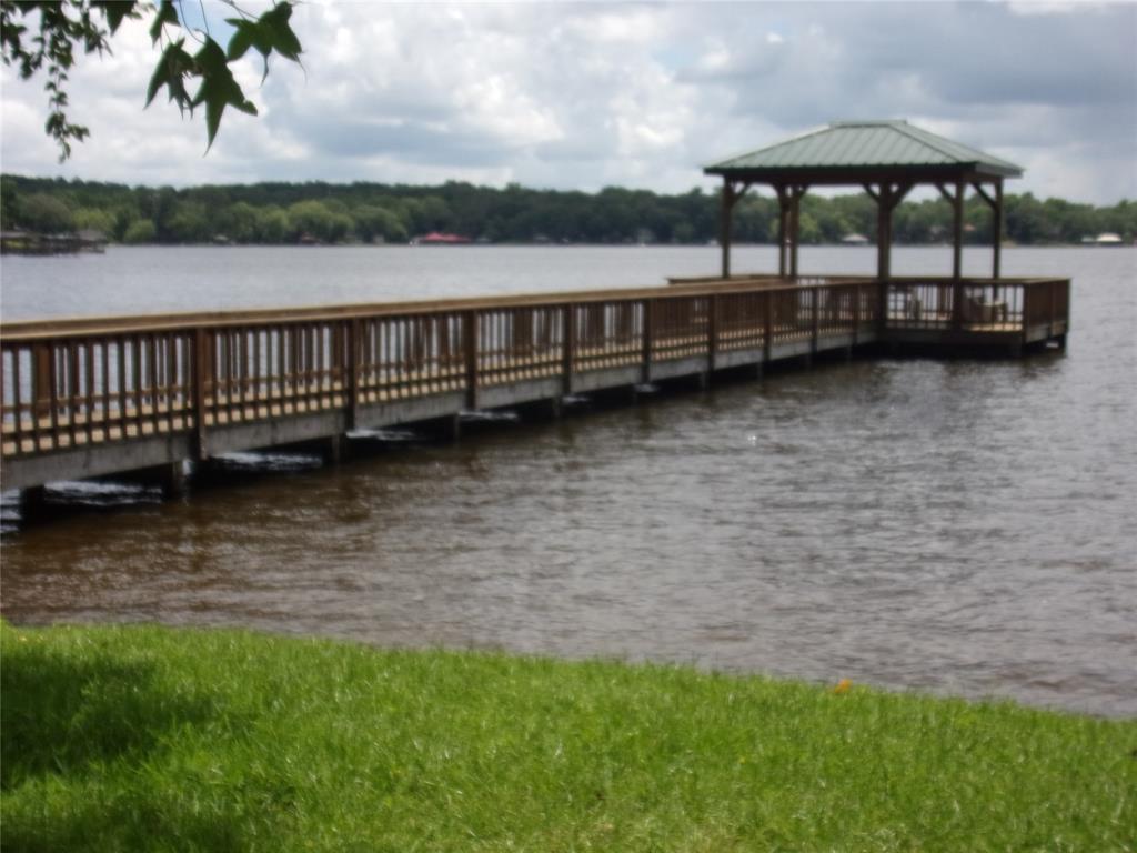 0 Hideaway Murchison, TX 75778 - Photo 8 of 11 a view of a lake with a lounge chair