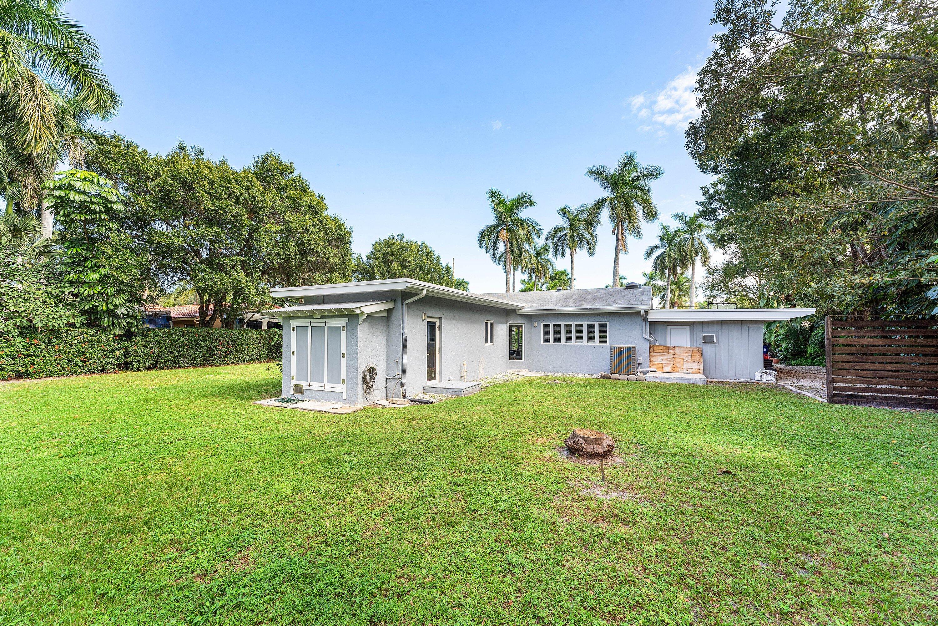 2573 Southwest 30th Terrace Fort Lauderdale, FL 33312 - Photo 15 of 44 a view of a house with a yard and sitting area
