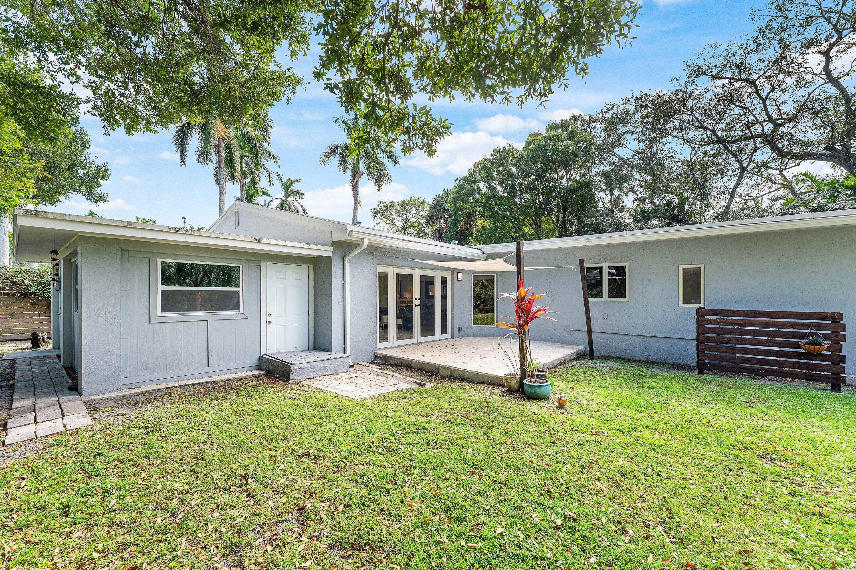2573 Southwest 30th Terrace Fort Lauderdale, FL 33312 - Photo 17 of 44 a view of a house with a yard and large tree