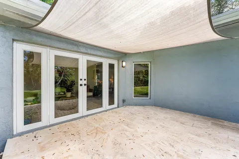 a view of a porch with a backyard
