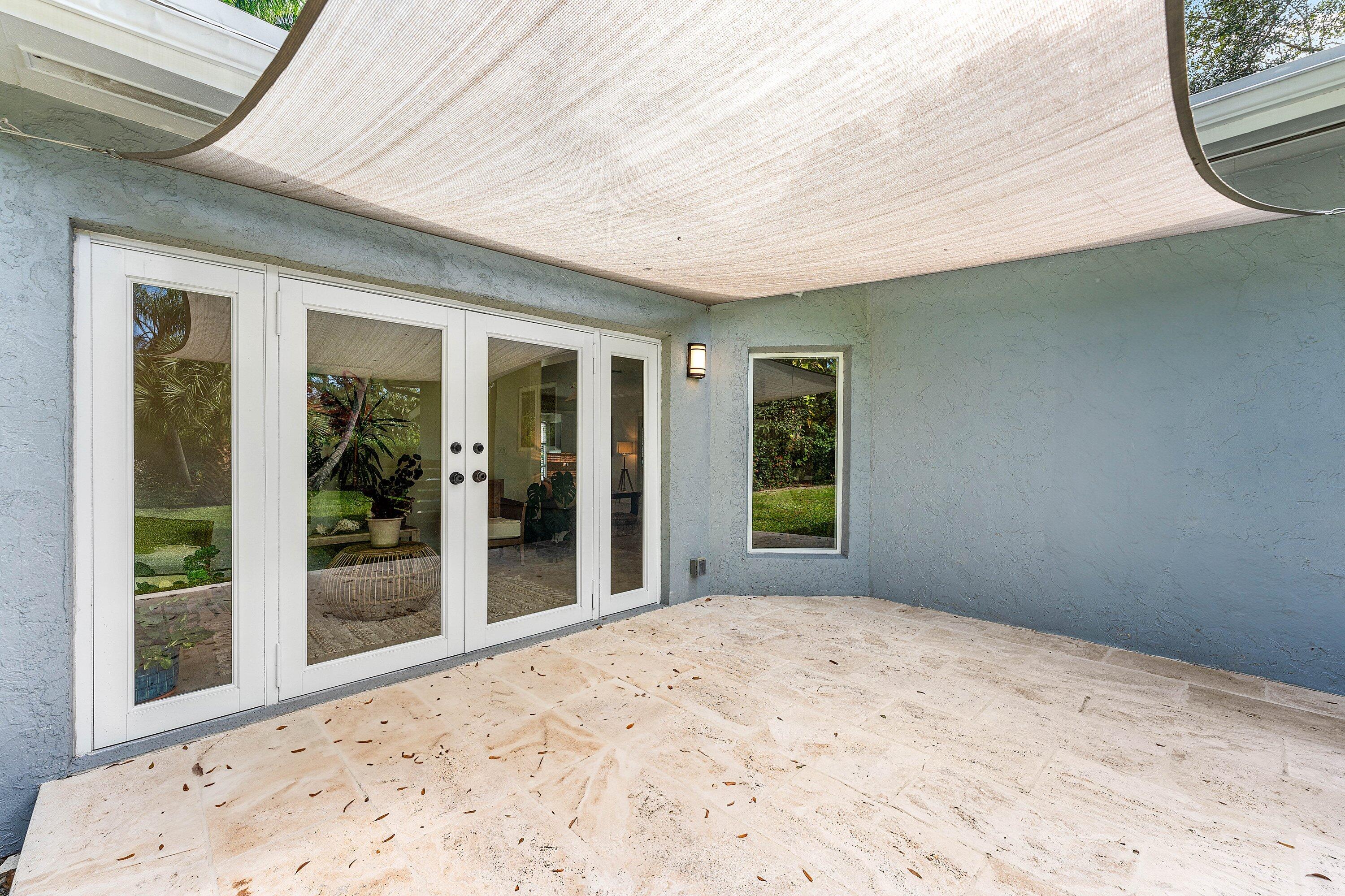 2573 Southwest 30th Terrace Fort Lauderdale, FL 33312 - Photo 18 of 44 a view of a porch with a backyard