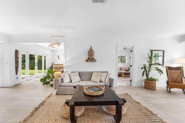 a living room with furniture and a table