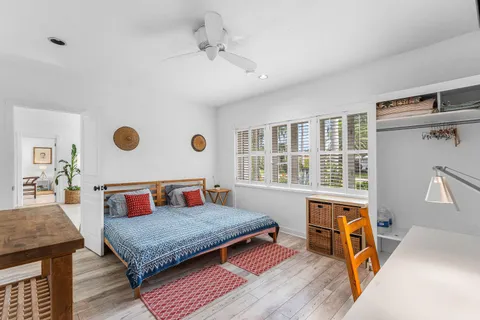 a bedroom with a bed and a table in it