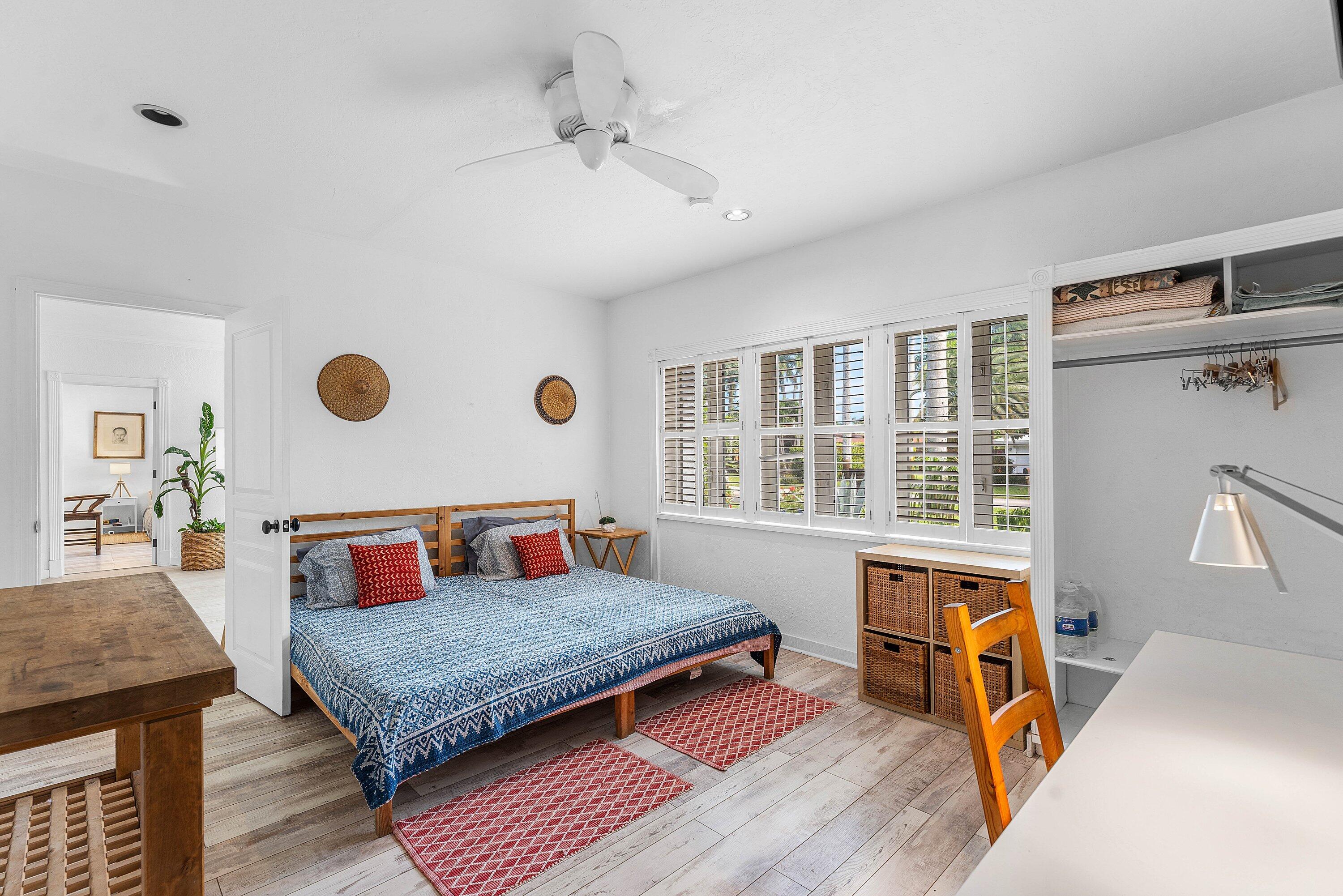 2573 Southwest 30th Terrace Fort Lauderdale, FL 33312 - Photo 31 of 44 a bedroom with a bed and a table in it