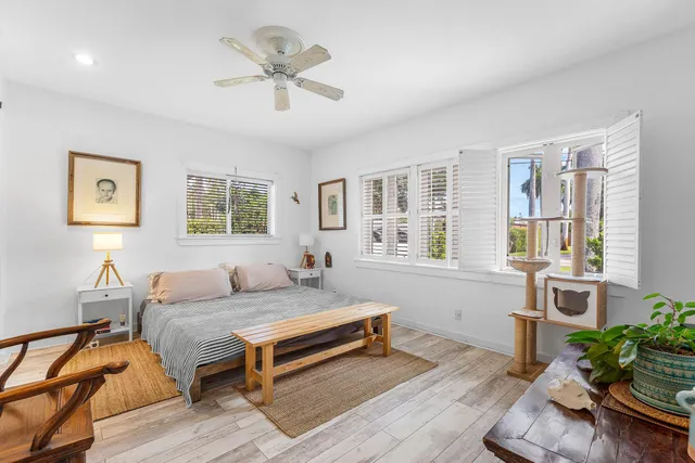 a bedroom with furniture and a window