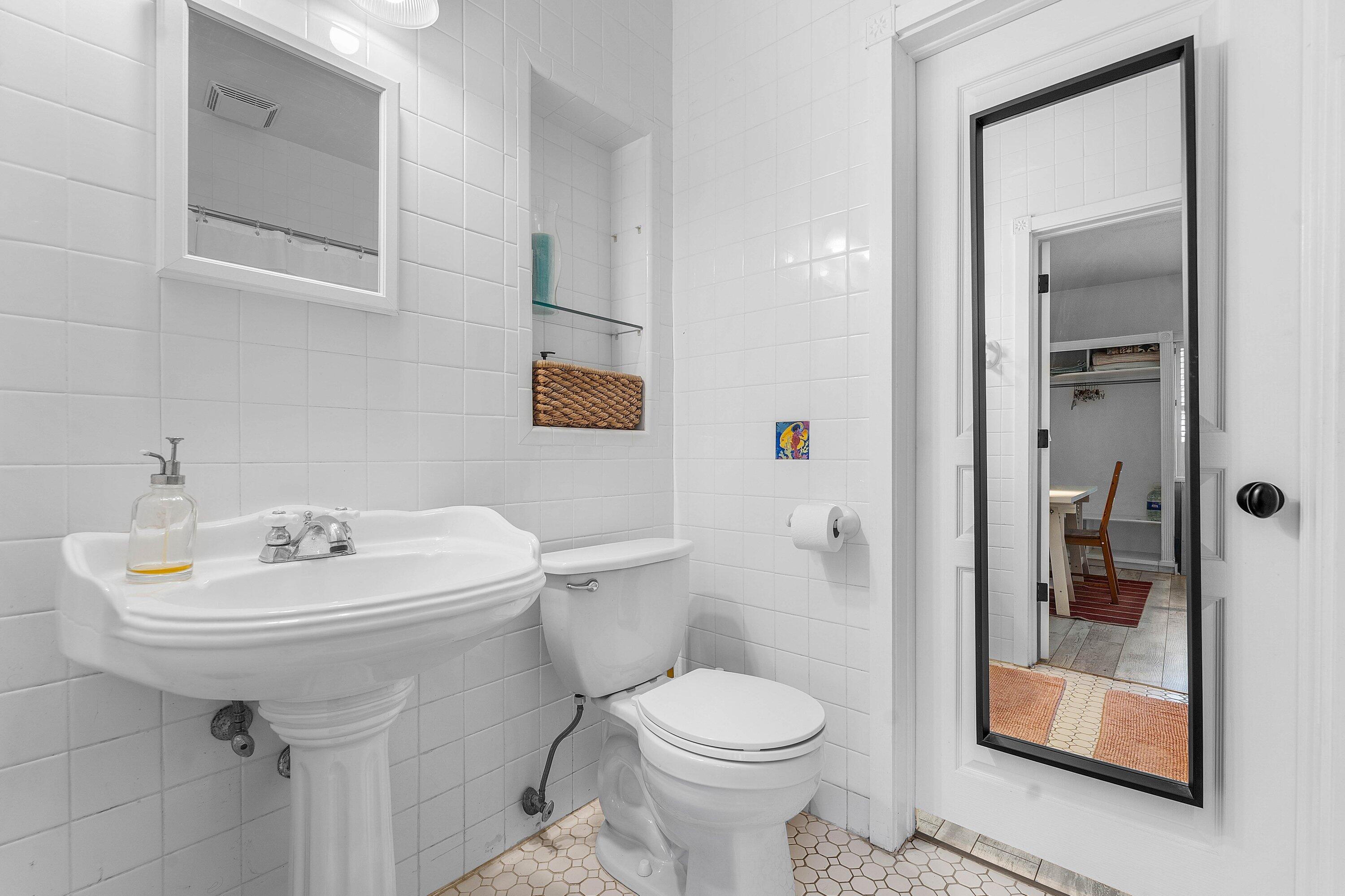 2573 Southwest 30th Terrace Fort Lauderdale, FL 33312 - Photo 42 of 44 a bathroom with a sink toilet and shower