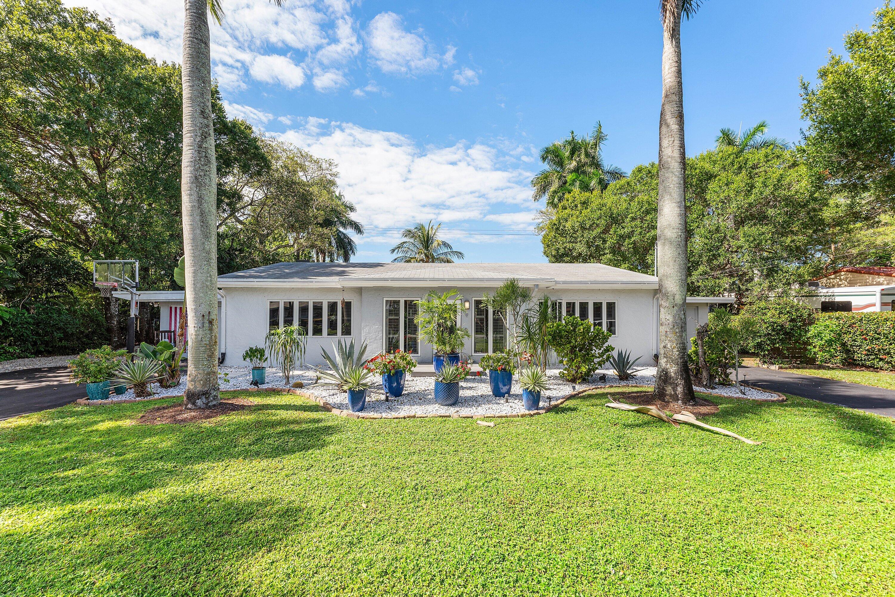 2573 Southwest 30th Terrace Fort Lauderdale, FL 33312 - Photo 43 of 44 a front view of a house with garden