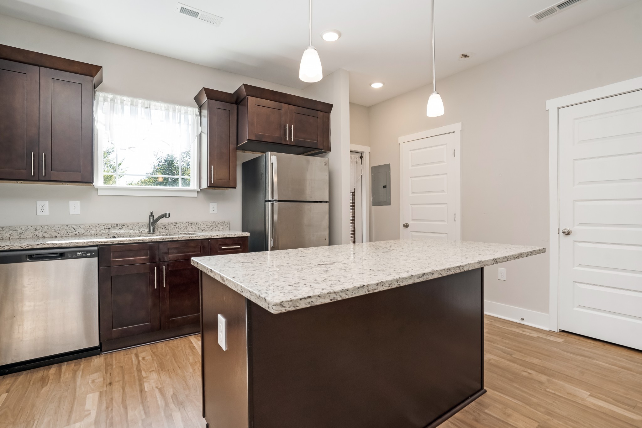 4012 Angelica Ct Spring Hill, Unit 4012 Spring Hill, TN 37174 - Photo 4 of 12 a kitchen with stainless steel appliances granite countertop a sink refrigerator and microwave