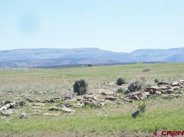 a view of a lake with mountains in the background