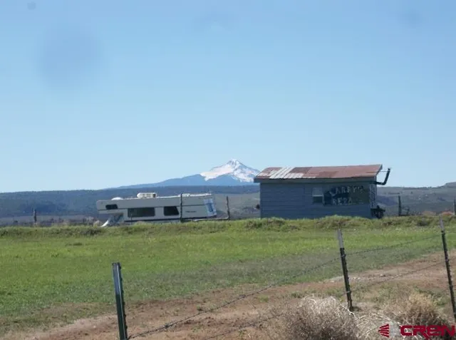 a aerial view of a house with a yard
