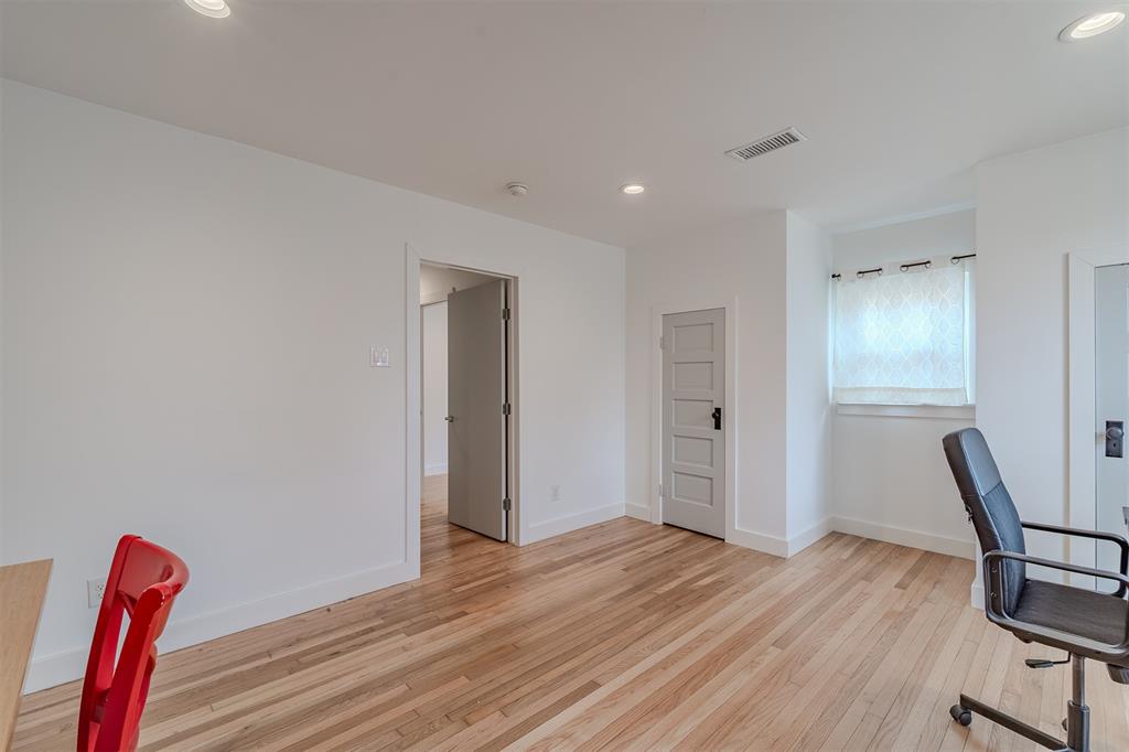 8927 Diceman Drive Dallas, TX 75218 - Photo 20 of 33 a view of a room with wooden floor and furniture