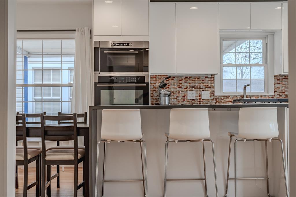 8927 Diceman Drive Dallas, TX 75218 - Photo 2 of 33 a kitchen with cabinets and chairs