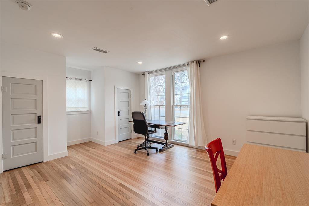 8927 Diceman Drive Dallas, TX 75218 - Photo 21 of 33 a view of a workspace with furniture and a bathroom