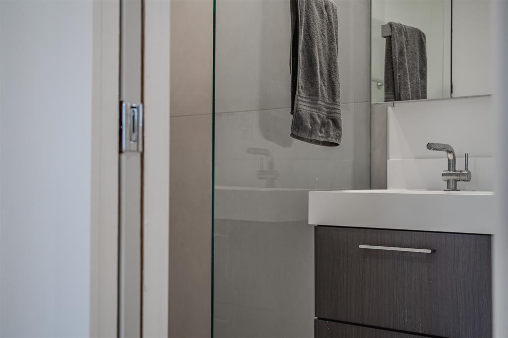8927 Diceman Drive Dallas, TX 75218 - Photo 26 of 33 a bathroom with a sink and a mirror