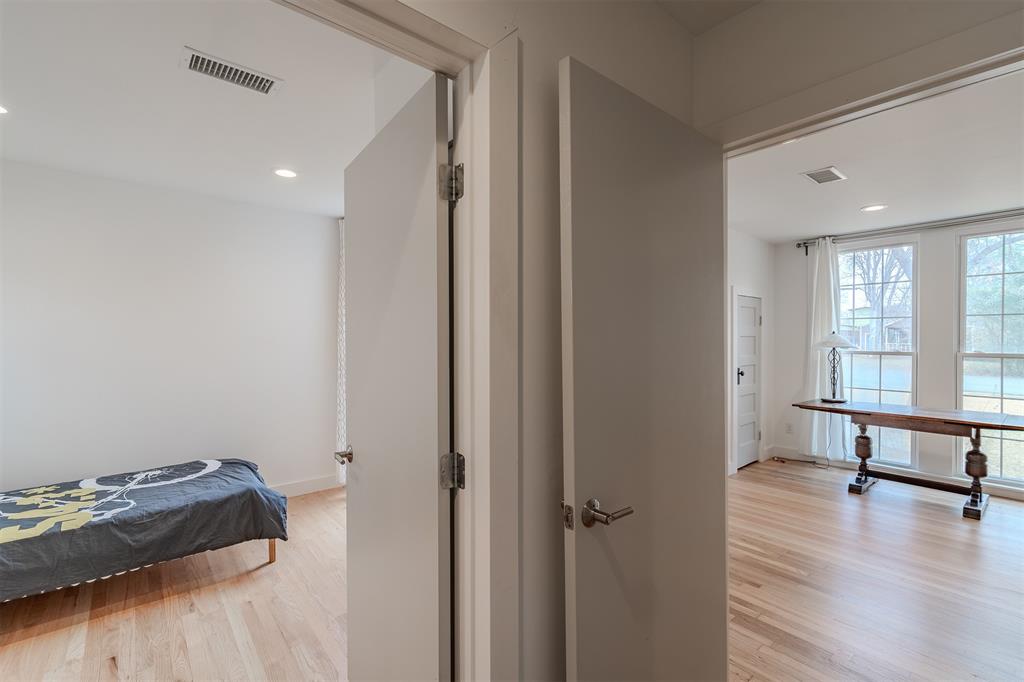 8927 Diceman Drive Dallas, TX 75218 - Photo 27 of 33 a view of a room with wooden floor and window