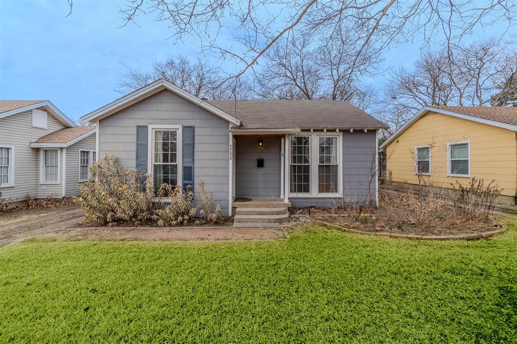 8927 Diceman Drive Dallas, TX 75218 - Photo 29 of 33 front view of a house with a yard