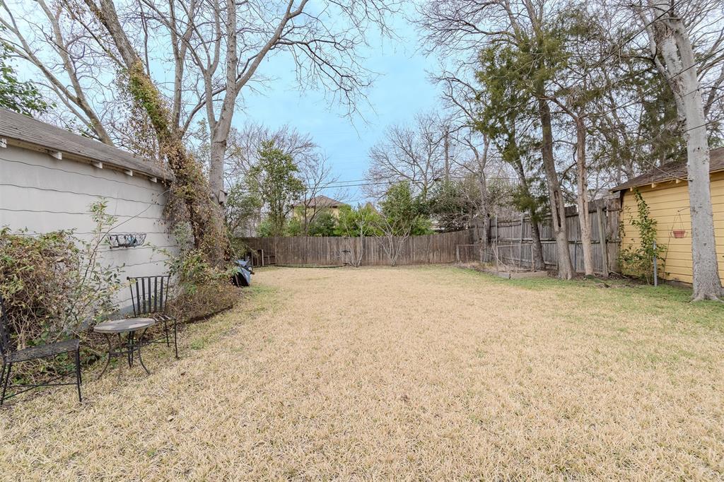 8927 Diceman Drive Dallas, TX 75218 - Photo 32 of 33 a backyard of a house with lots of green space