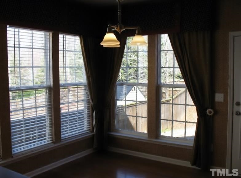 5328 Shaker Heights Lane Raleigh, NC 27613 - Photo 13 of 25 a view of an empty room with a window