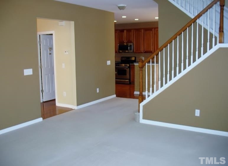 5328 Shaker Heights Lane Raleigh, NC 27613 - Photo 17 of 25 a view of hallway with stairs