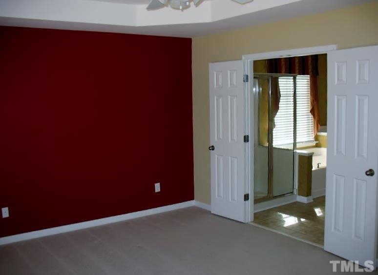 5328 Shaker Heights Lane Raleigh, NC 27613 - Photo 19 of 25 an empty room with windows