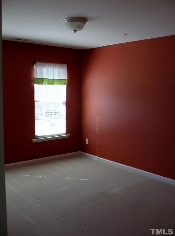 5328 Shaker Heights Lane Raleigh, NC 27613 - Photo 23 of 25 an empty room with a empty space and a window