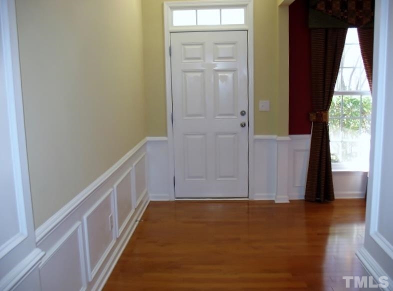 5328 Shaker Heights Lane Raleigh, NC 27613 - Photo 4 of 25 wooden floor in an empty room