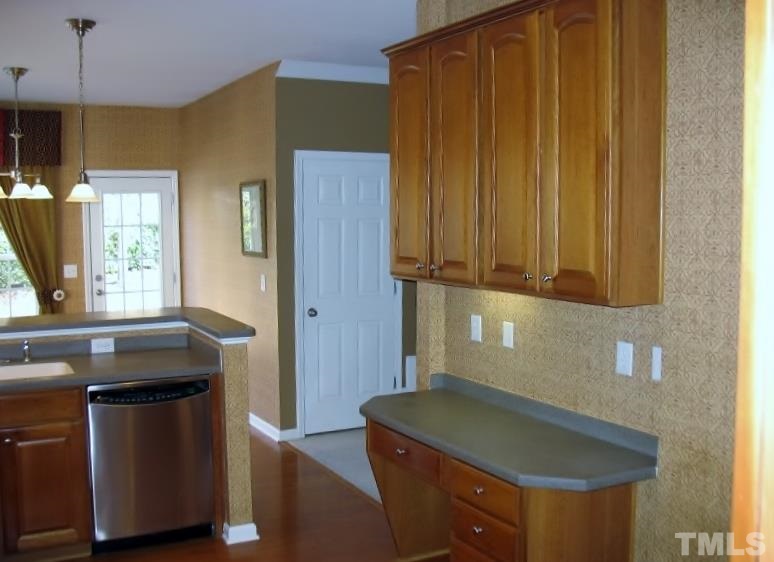 5328 Shaker Heights Lane Raleigh, NC 27613 - Photo 10 of 25 a kitchen with a sink and a cabinet