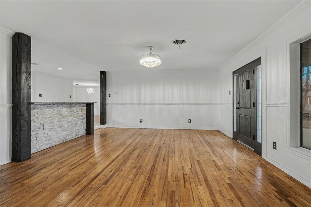 1714 East Union Bower Road Irving, TX 75061 - Photo 8 of 32 a view of a room with wooden floor and brick walls