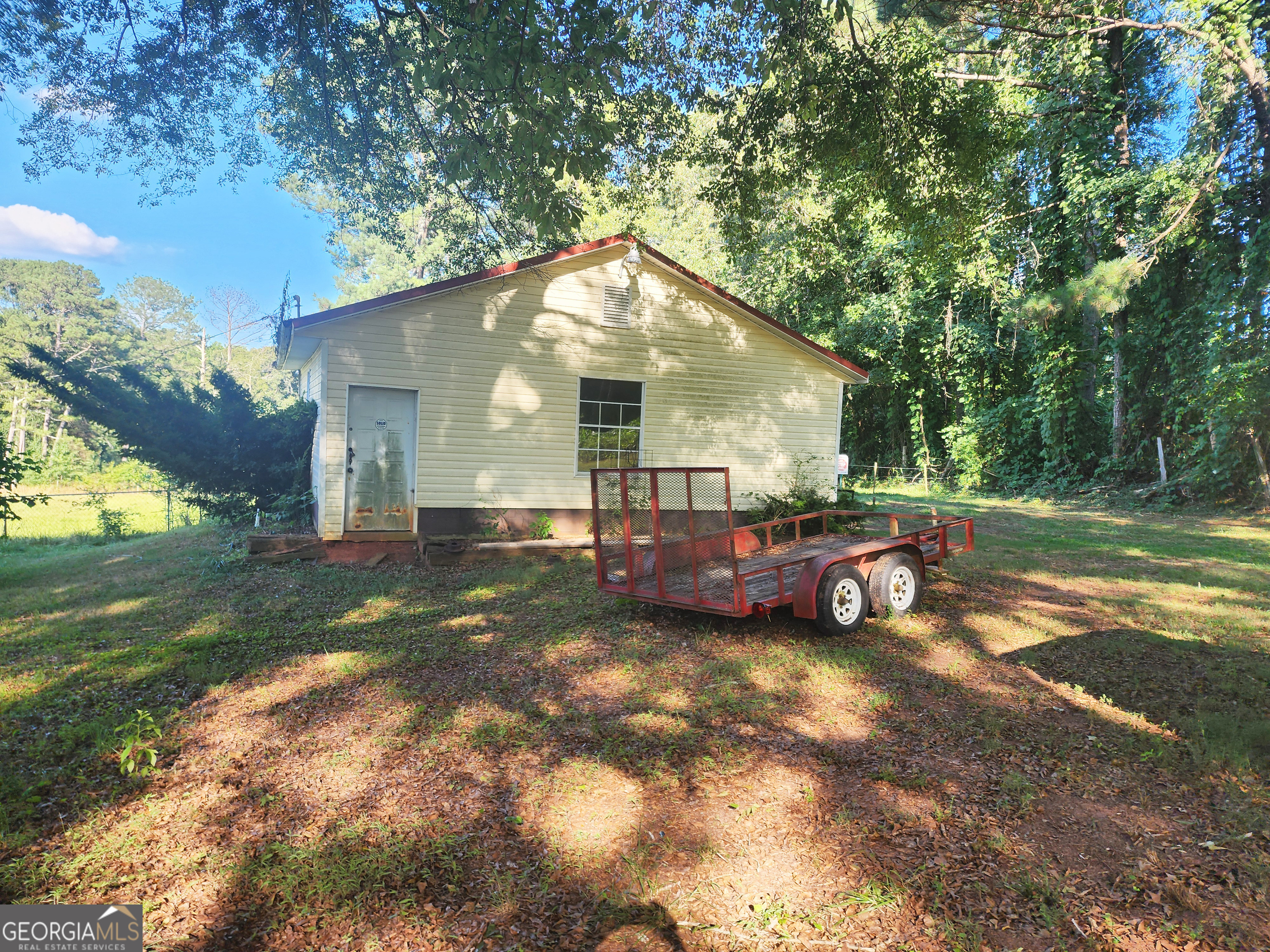 433 Mt Moriah Road Auburn, GA 30011 - Photo 5 of 9 a view of backyard with swimming pool and outdoor seating