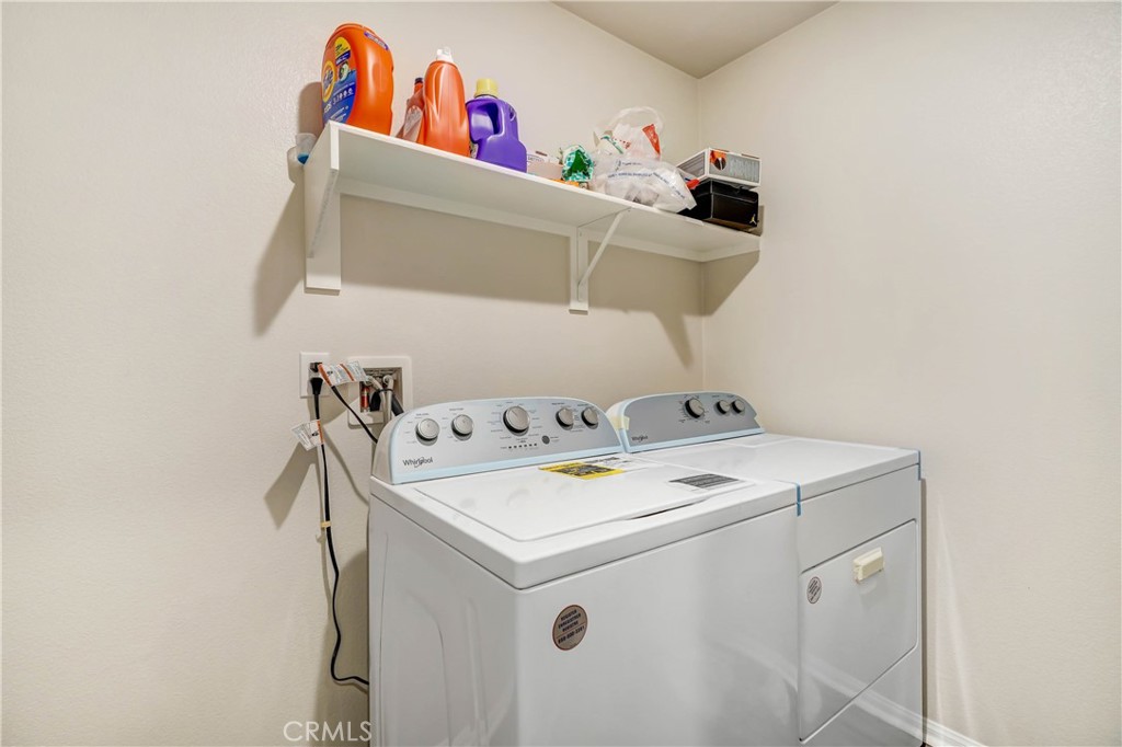 24871 Tiger Avenue Moreno Valley, CA 92551 - Photo 12 of 13 a utility room with dryer and washer