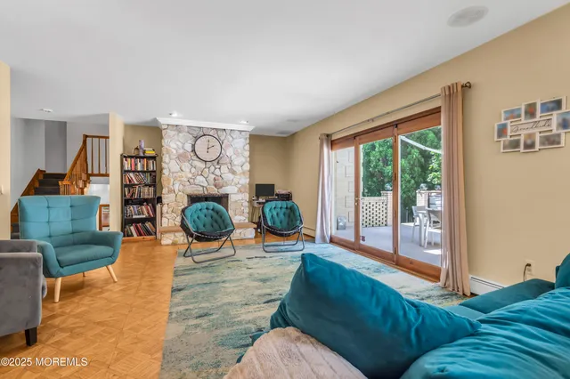 a living room with couch and a floor to ceiling window
