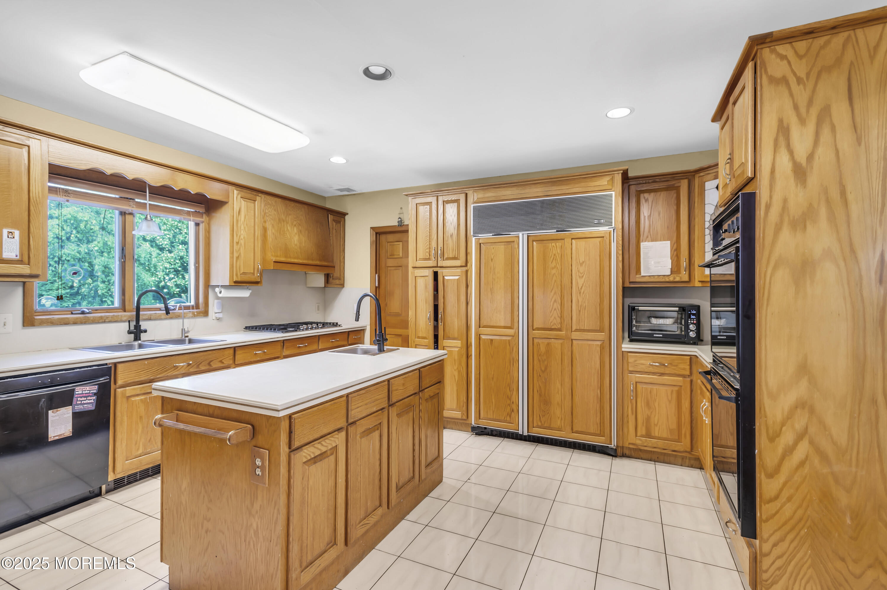 1350 Church Road Toms River, NJ 08755 - Photo 19 of 52 a kitchen that has a sink a stove top oven a refrigerator and a cabinets