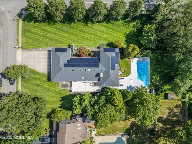 an aerial view of a house with a garden