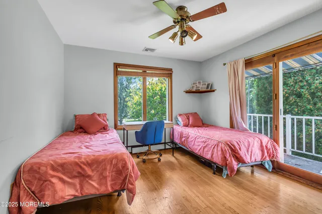 a bed room with a bed and a window