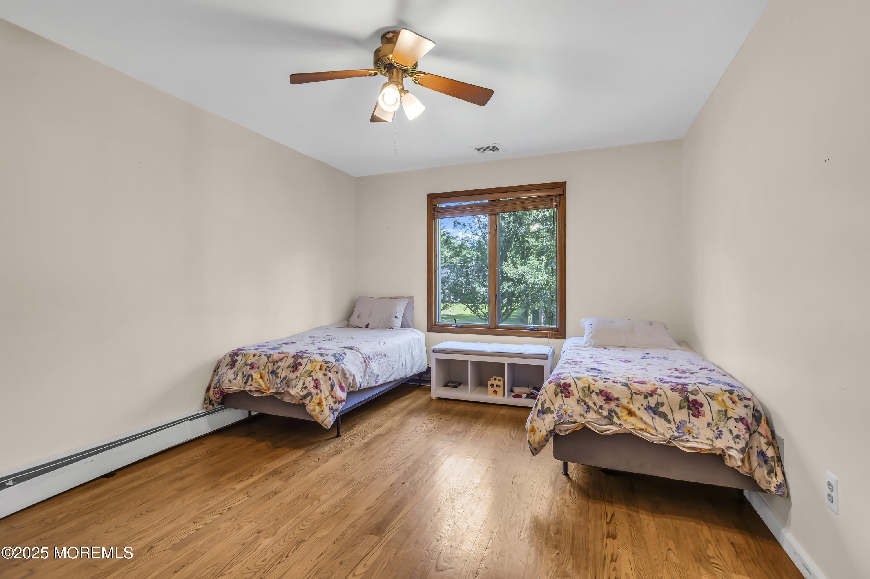 1350 Church Road Toms River, NJ 08755 - Photo 32 of 52 a bedroom with a bed and a chandelier