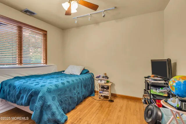 a bedroom with furniture and a window