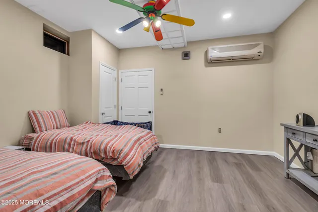 a bedroom with two beds and a chandelier