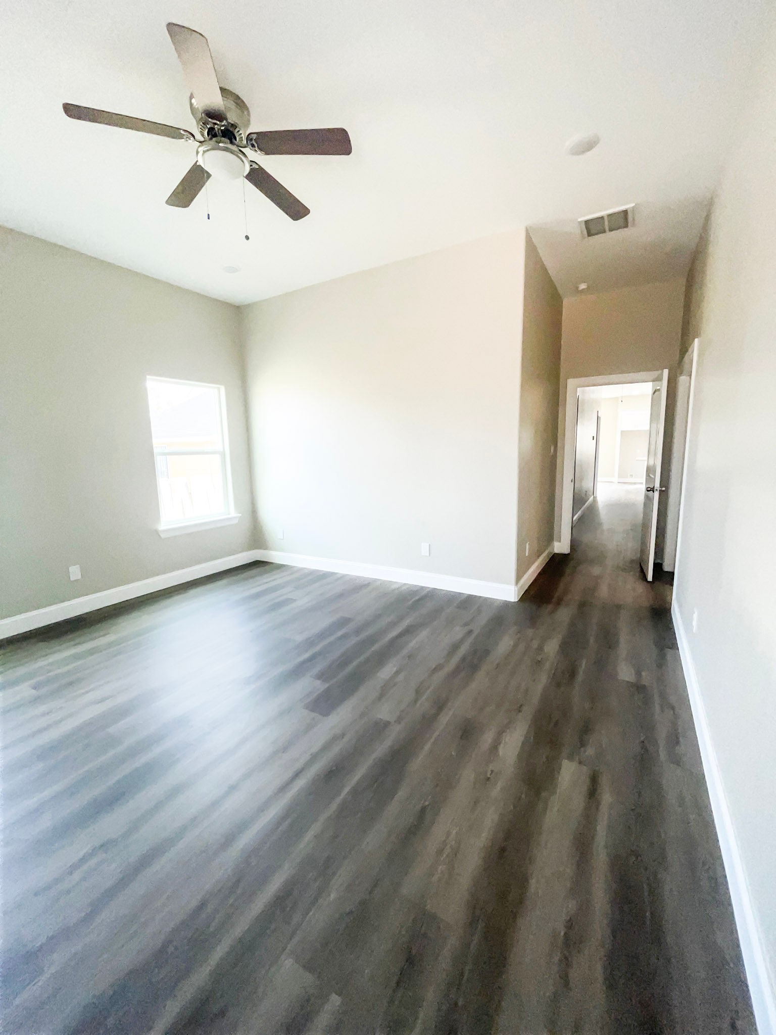 8309 Parker Road, Unit A Houston, TX 77078 - Photo 9 of 10 a view of an empty room with a window